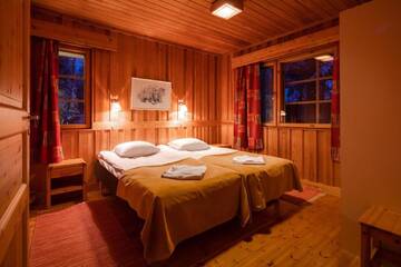 Фото номера Апартаменты с 2 спальнями и сауной Курортные отели Pyhän Asteli Log Cottages г. Пухатунтури 8