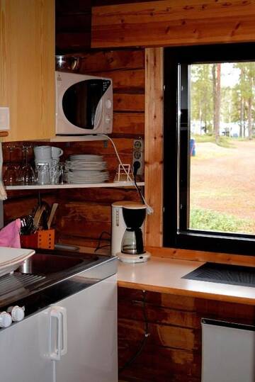 Фото номера Коттедж «Кеттула» Курортные отели Pyhän Asteli Log Cottages г. Пухатунтури 5