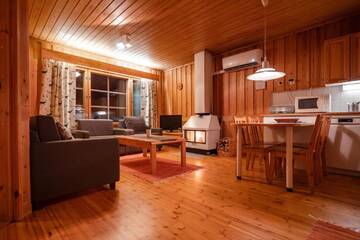 Фото номера Апартаменты с 2 спальнями и сауной Курортные отели Pyhän Asteli Log Cottages г. Пухатунтури 9